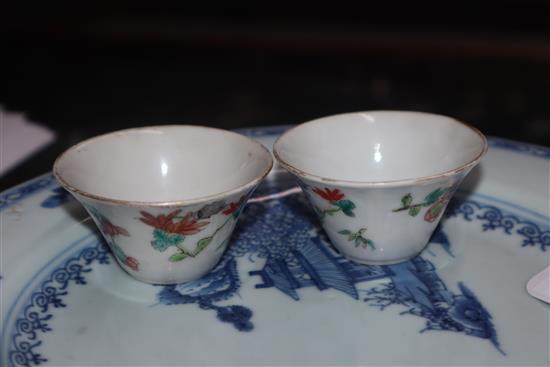 Two 18th century Chinese Nanking cargo plates, a bowl and a snuff bottle and two 19th century Chinese famille rose small bowls